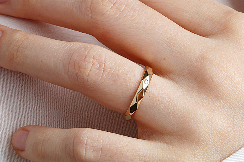 14K Gold 3mm Multi Faceted Wedding Band A Single Diamond